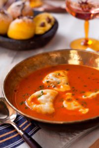 SPICED TOMATO BROTH WITH LAMB DUMPLINGS