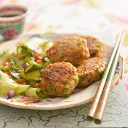 Wow the guests at your next dinner party with this easy menu for an authentic Thai feast THAI FISH CAKES INGREDIENTS 500g skinless and boneless fish fillets, such as hake or Cape whiting, cut into rough chunks 15ml Thai red curry paste 15ml Thai fish sauce 15ml fresh ginger, finely grated 10ml brown sugar 10ml cornflour 1 egg 6 green beans, thinly sliced 6 spring onions, thinly sliced 45ml fresh coriander, chopped 1 lime, zest and juice flour, for dusting oil, for frying FOR THE DIPPING SAUCE: 80g white sugar 60ml white vinegar 30ml water 15ml Thai fish sauce ½ small cucumber, deseeded and finely chopped 1 lemongrass stalk, thinly sliced 1 red chilli, deseeded and finely chopped TO SERVE: oriental-style salad (optional) METHOD 1. To make the fish cakes: place the fish, curry paste, fish sauce, ginger, sugar, cornflour and egg in a food processor; process until well combined but still a little chunky. 2. Transfer the mixture to a mixing bowl. Add the beans, spring onions, coriander, lime zest and juice and mix well. 3. Lightly dust your hands with a little flour and shape spoonfuls of the mixture into 12–16 patties. Place the patties in the fridge for 30 minutes to firm up. 4. Meanwhile make the dipping sauce: heat the sugar, vinegar and water in a pan, stirring constantly until the sugar dissolves. Turn up the heat and bring the sauce to the boil; boil it for 4–5 minutes without stirring, until it’s slightly syrupy. 5. Remove the sauce from the heat and allow it to cool completely before adding the remaining ingredients. Decant it into a serving bowl and set aside until needed. 6. Pour some oil into a medium-sized pan, filling it a third of the way up. Heat the oil and fry the fish cakes in batches for 4–5 minutes, turning frequently for even colouring or until golden and cooked through. (You could also use a deep fat fryer.) 7. Drain the fish cakes on kitchen paper and serve immediately accompanied by the dipping sauce and a fresh oriental-style salad. (Serves 6–8)