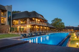 a pool and well-lit accomodation at aquila game reserve