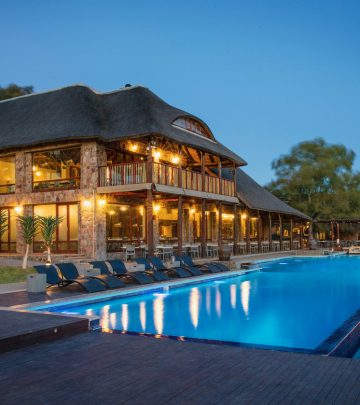 a pool and well-lit accomodation at aquila game reserve