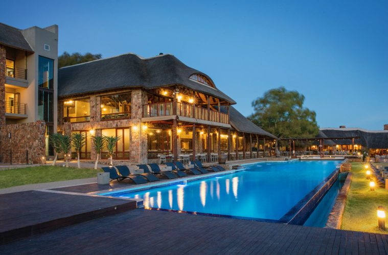 a pool and well-lit accomodation at aquila game reserve