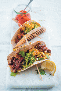 Tacos with vindaloo beans, crushed avocado and charred corn
