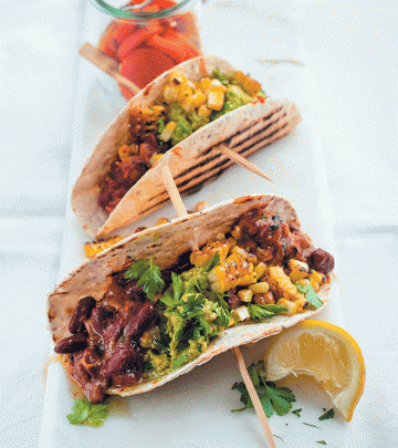 Tacos with vindaloo beans, crushed avocado and charred corn