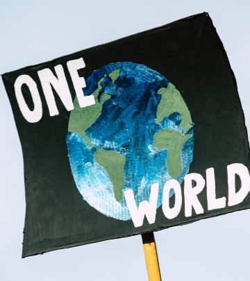 a protest placard saying one world