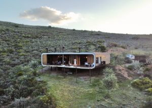 an eco pod in the middle of an open bush