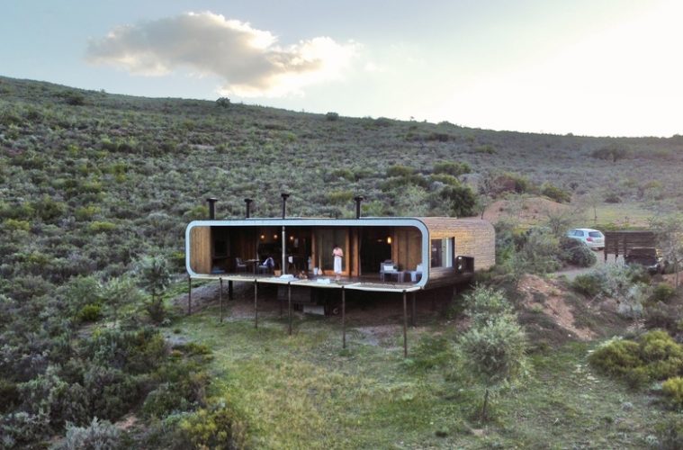 an eco pod in the middle of an open bush