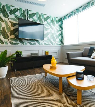 a room with vibrant tables, indoor plants