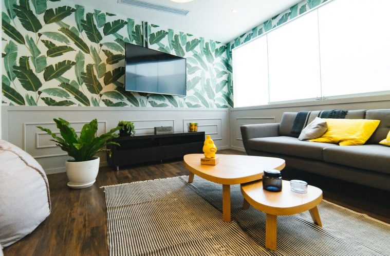 a room with vibrant tables, indoor plants