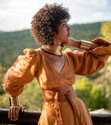 a stylish woman wearing earthy tones in nature