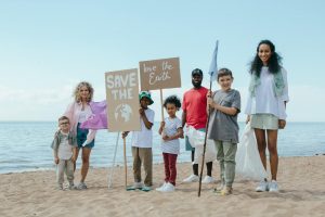 a group of volunteers cleaning a beach