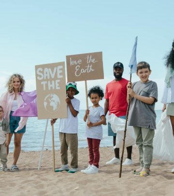 a group of volunteers cleaning a beach