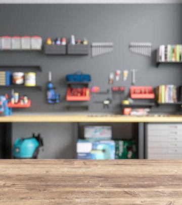 Empty Wooden Table Top With Blur Garage Interior