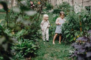 two kids in the garden
