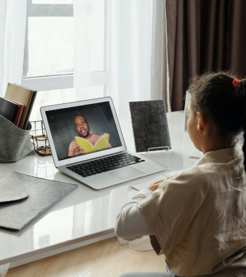 A little girl studying at a desk