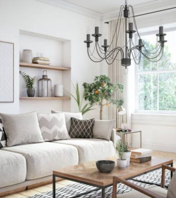 Apartment living room with beige colored furniture and wooden elements