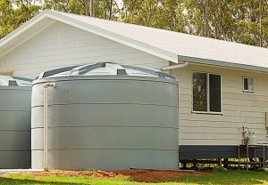 Tank System Australian building rainwater conservation tanks for water supply on new house in rural region