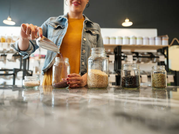 woman repurposing jars with grains