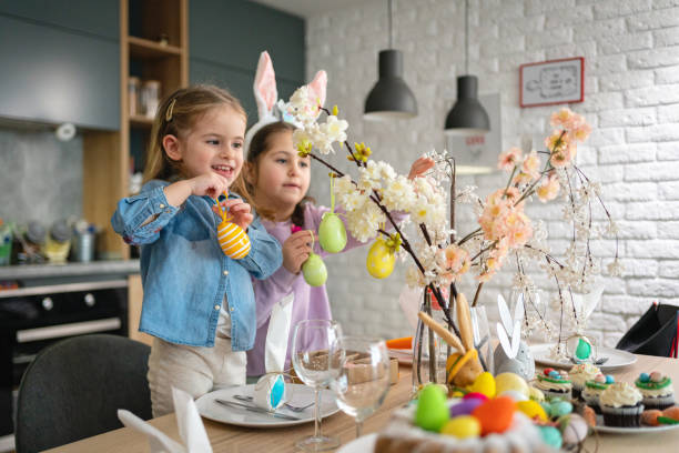 sisters decorating the dining table for an Easter lunch