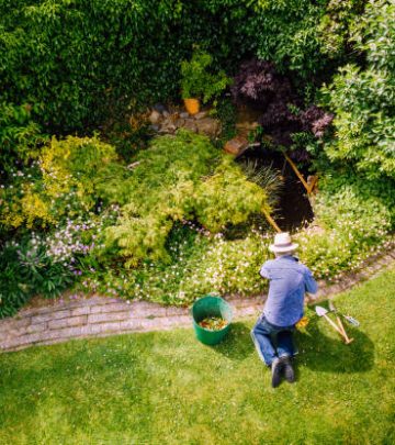 Aerial view of a man maintaining his garden lawn.