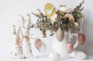 Easter holiday Bouquet of flowers, white rabbits and Easter eggs