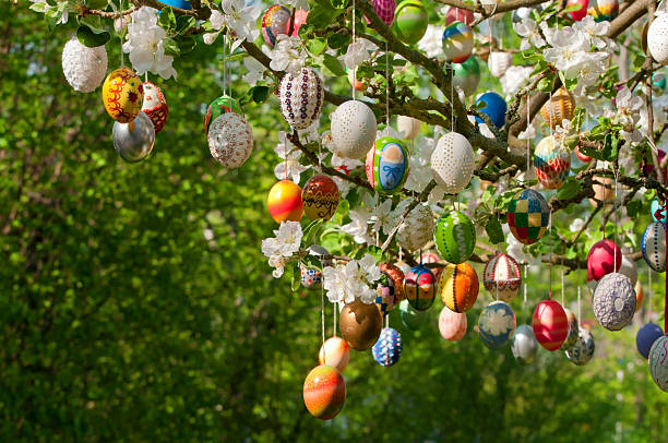 Eastereggs hanging on tree. A lot of colorful and handmade eggs.