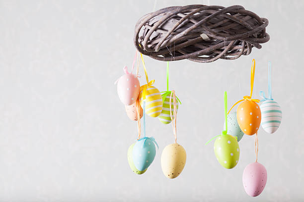 Easter ceiling-mounted mobile with colour eggs on ribbons