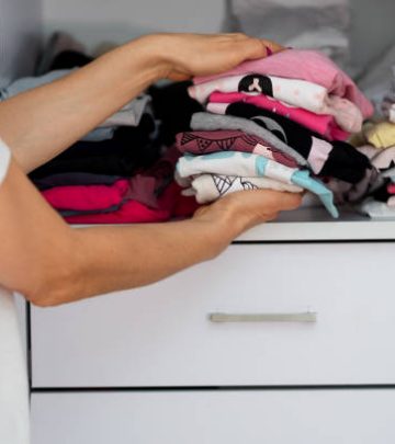 Mom sorting out kids closet at home