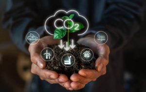 Reduce CO2 emission concept sign in the hand