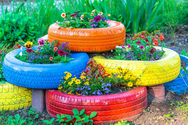 Budget-Friendly Garden - Old tyres that are painted in assorted colors and used for a flower planter.
