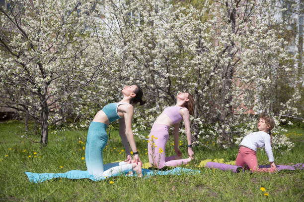 Outdoor Yoga classes between mother and daughter 