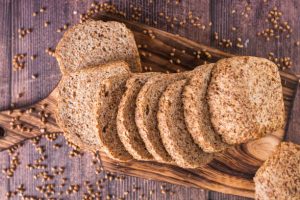 Close up of sliced buckwheat bread on a cutting board