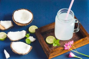 Fresh organic coconut water in a jar.