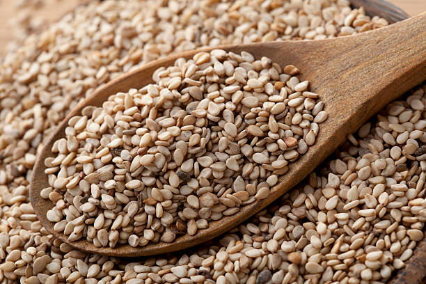 Sesame seeds in wooden spoon