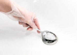 Drain blockage removing with baking soda Unclogging sink drains in your home