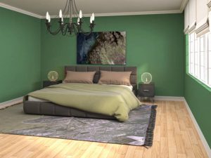 Green Bedroom accent wall with a chandelier
