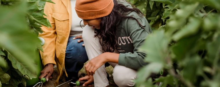 mother and daughter gardening on clay soil