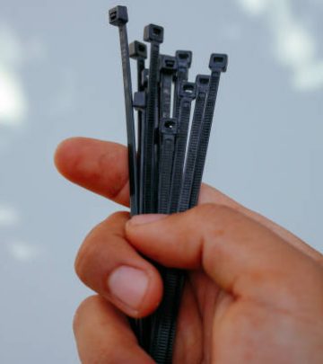 holding black cable tie
